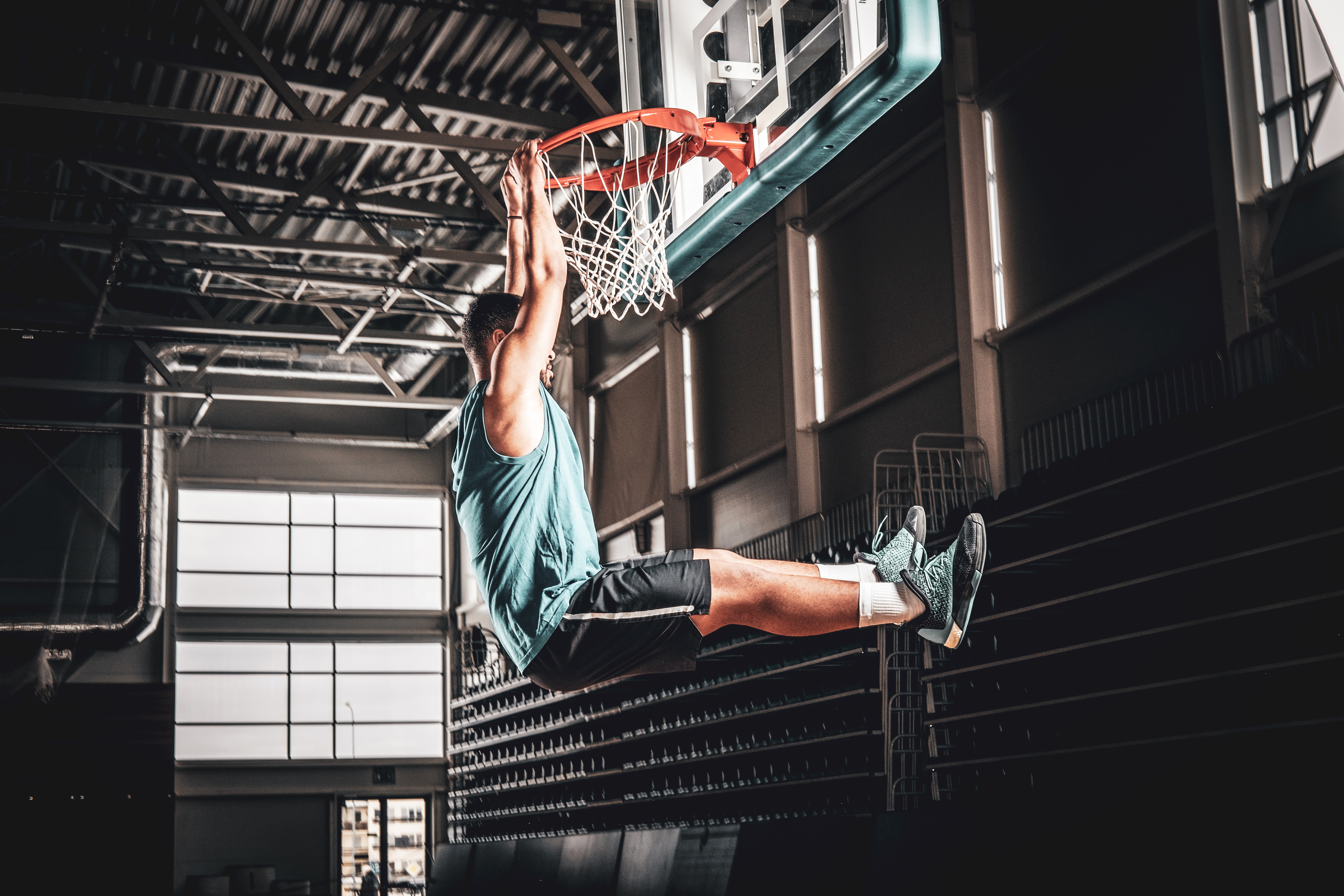 Basketball hoop under arena lights
